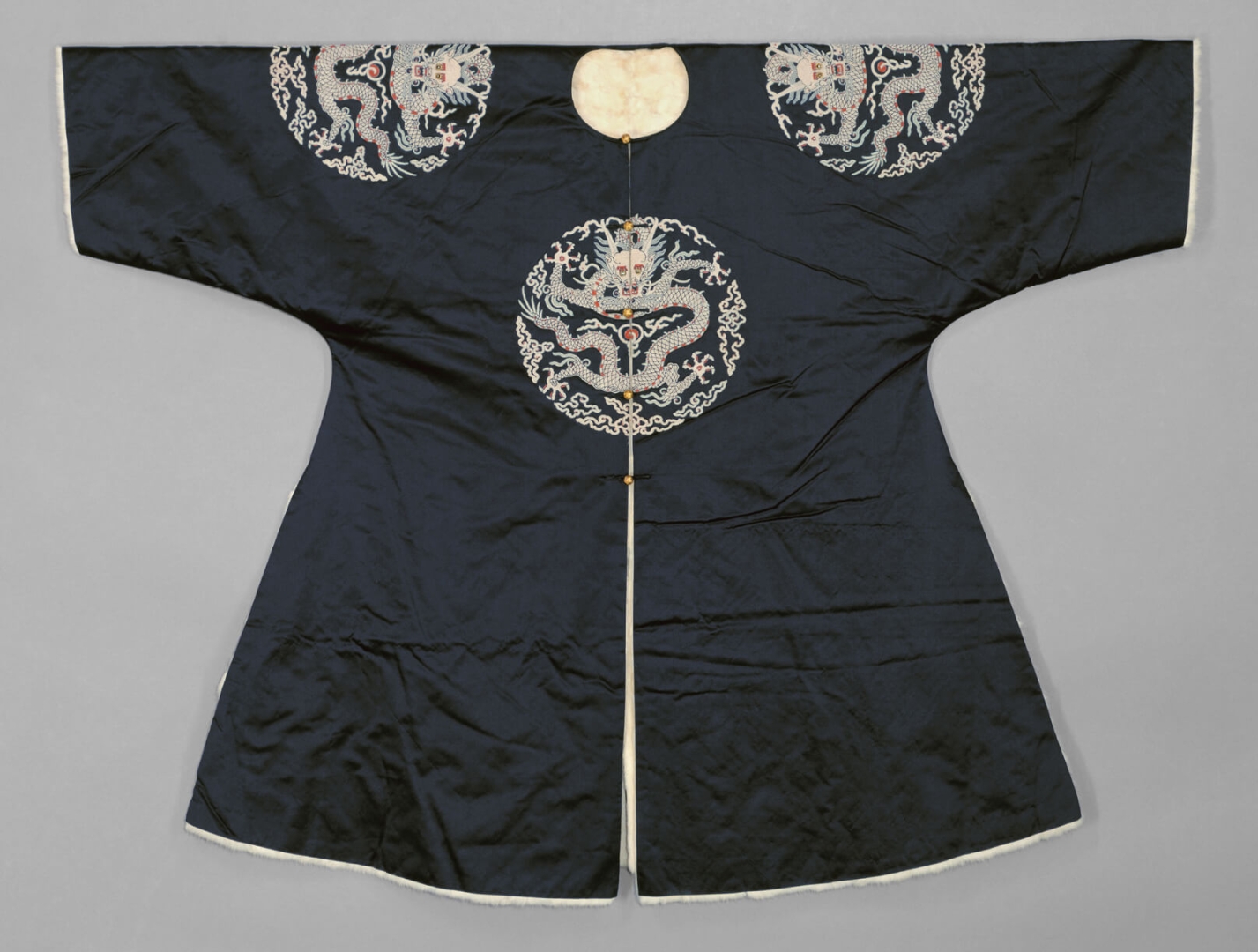 Dark Blue Satin Ermine-lined <br />
Surcoat with Four Dragon <br />
Roundels in Seed-pearl Embroidery
